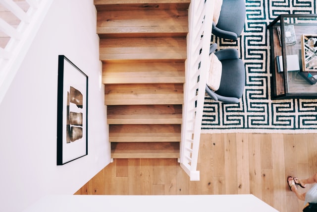 wooden staircase and a framed picture on the wall
