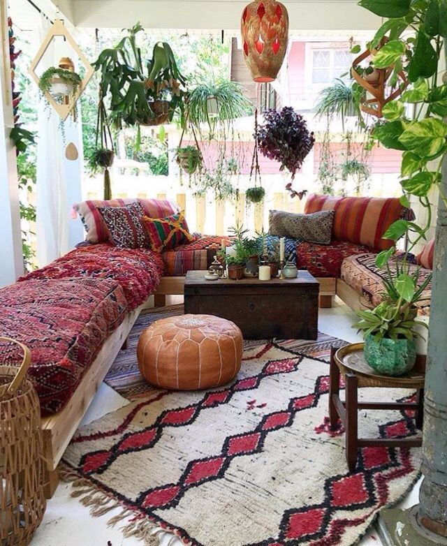 Pretty Little Patio with Red Accents and Hanging Plants