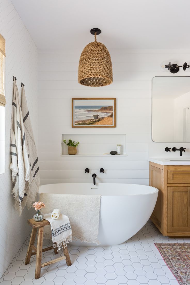 A Large Master Bathroom with Separated Bathtub