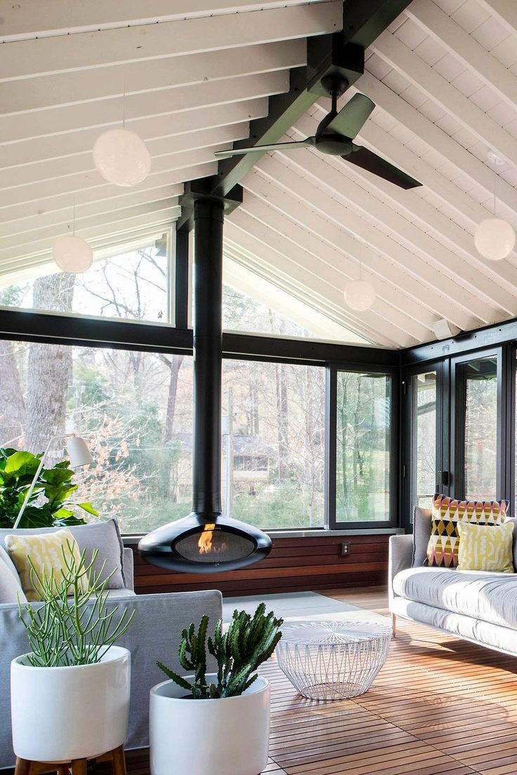 A Screened-In Design as A Fireplace Sunroom